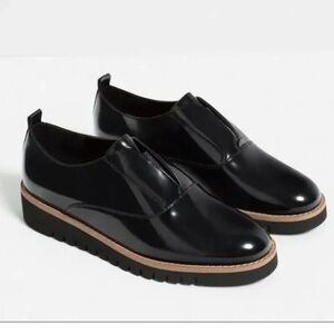 Zara Black Patent Leather Slip-On Loafers with Tan Trim
